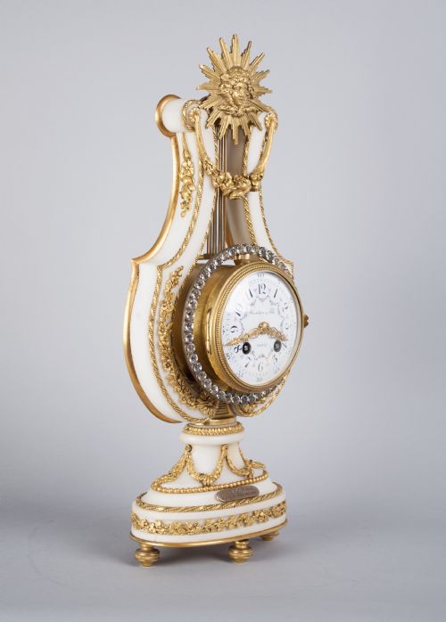 fig 1. An Ormolu Mounted White Marble Striking Lyre Mantel Clock