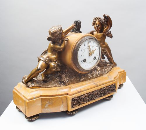 fig 2. A Bronze and Sienna Marble French Mantel Clock.