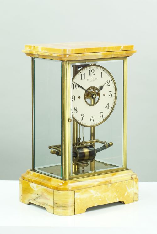 A Sienna Marble Electric Bulle Four-glass Mantel Clock