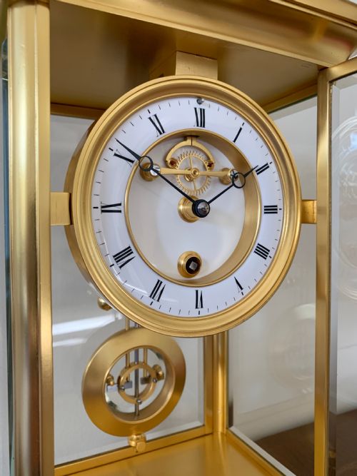 fig 1. A rare one year duration French gilt brass four-glass mantel timepiece, circa 1880.