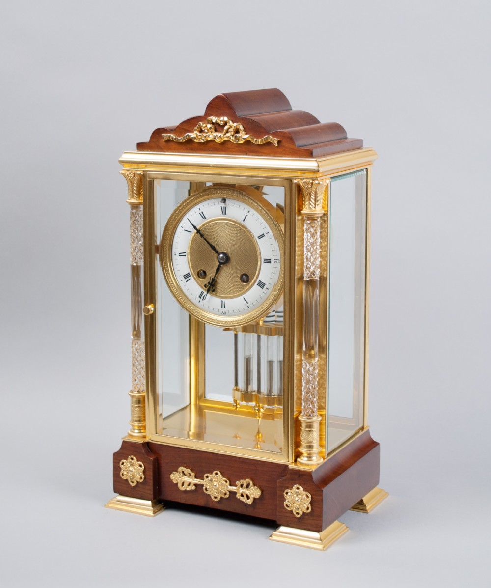 A fine quality gilt brass and mahogany four glass mantel clock