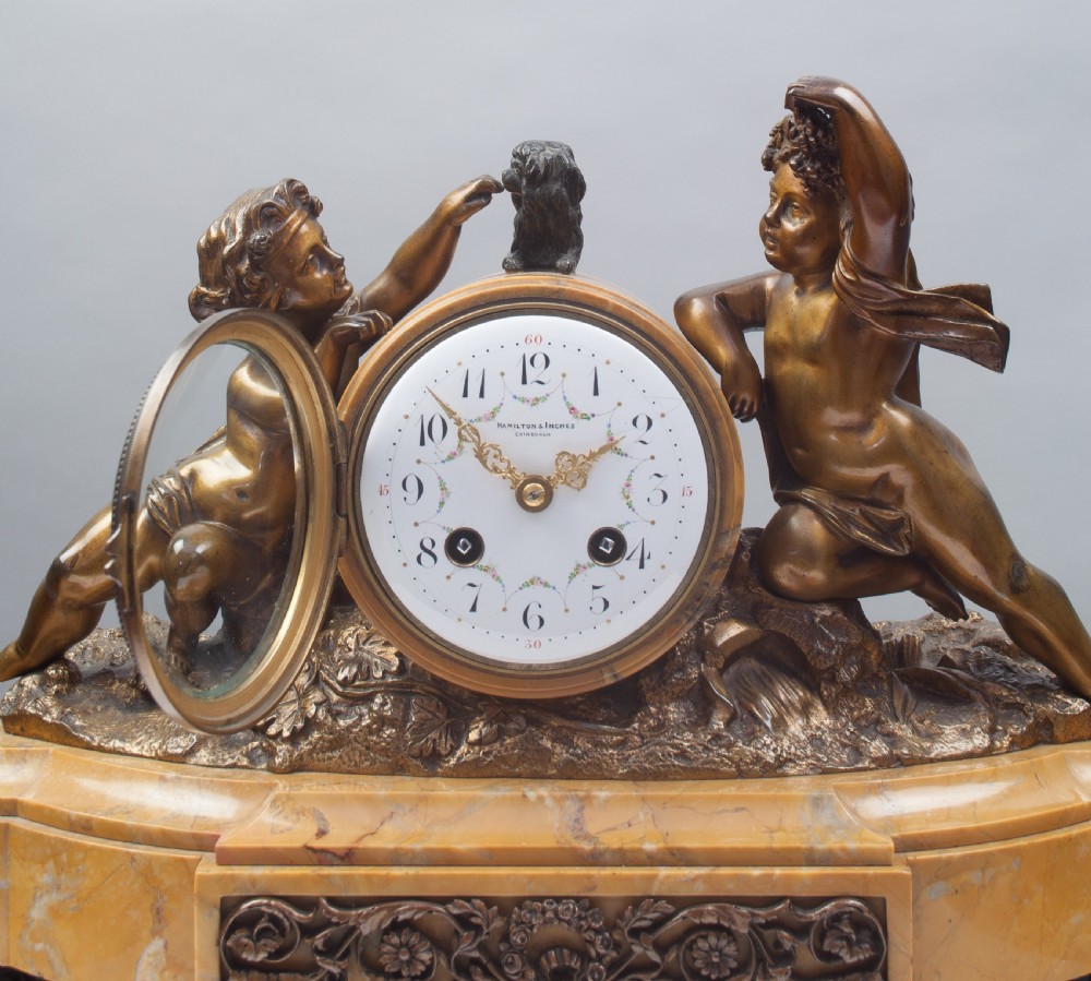 A Bronze and Sienna Marble French Mantel Clock. View II