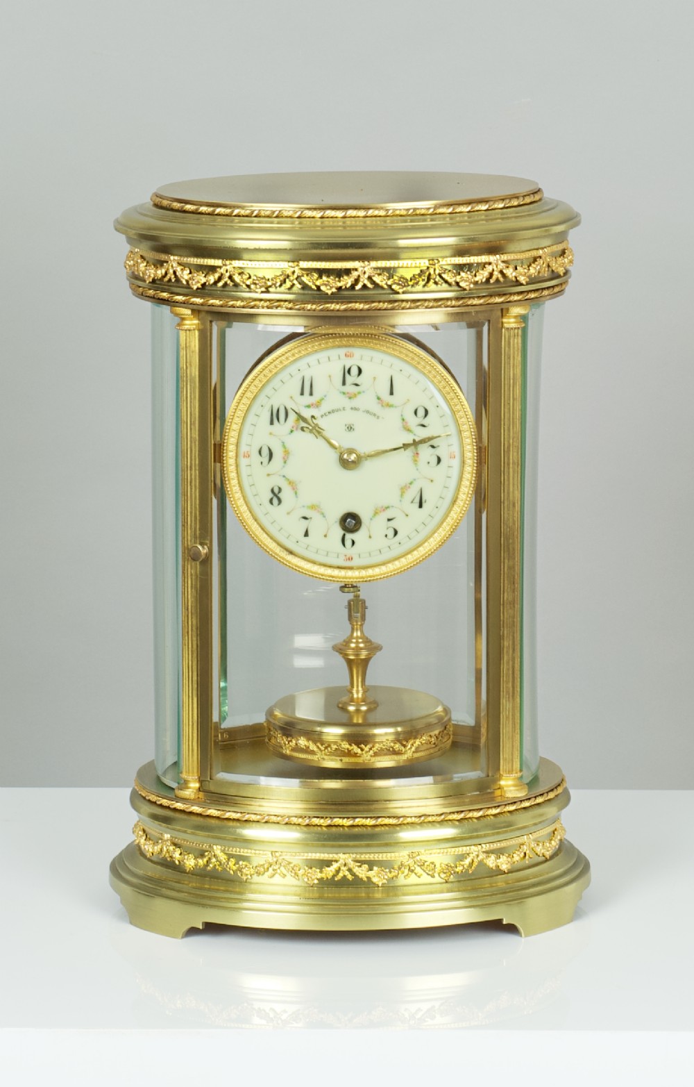 A fine quality French Claude Grivolas Oval Cased 400 Day Torsion Mantel Clock