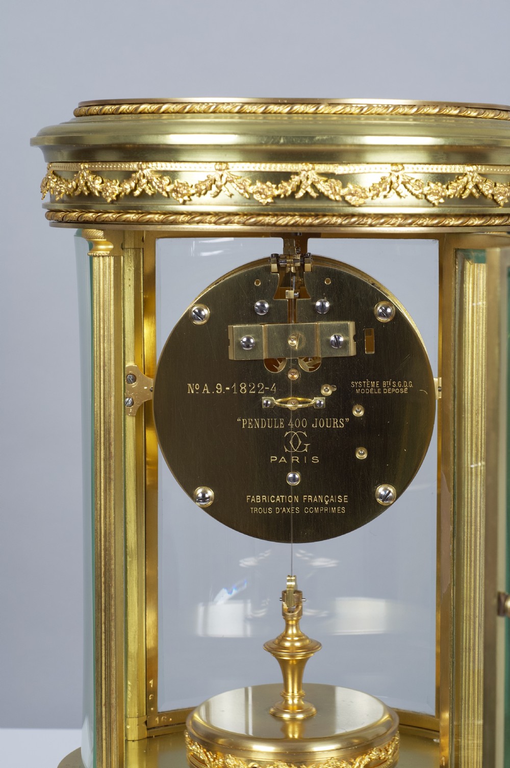 A fine quality French Claude Grivolas Oval Cased 400 Day Torsion Mantel Clock View V