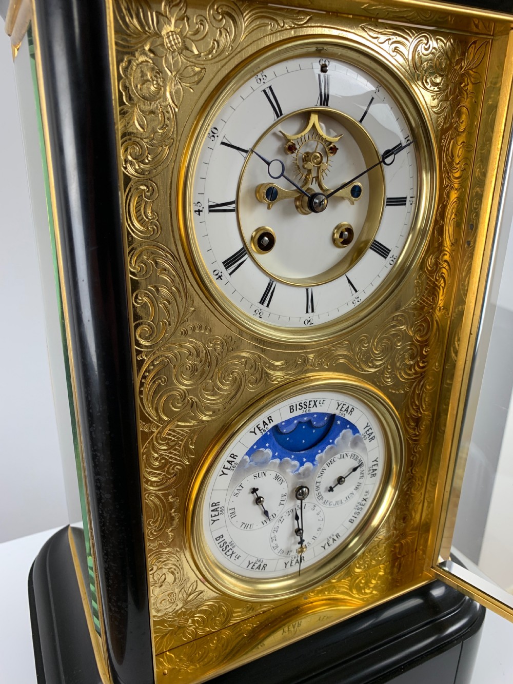 A fine quality 19th French four-glass mantel clock with perpetual calendar and moonphase indication. View XII