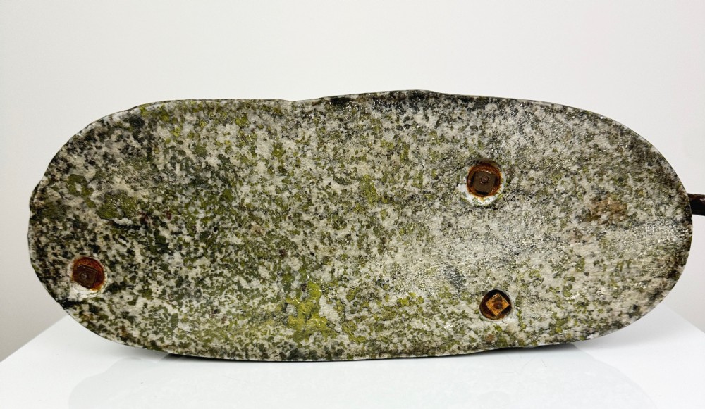 A patinated dark brown bronze sculpture depicting a crouching panther drinking water from a speckled grey stone base. View XVI