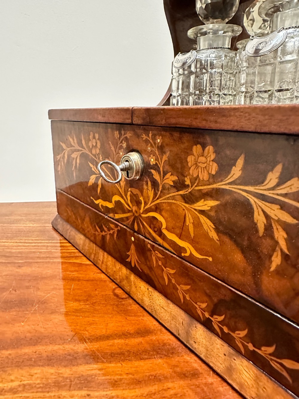 A Fine Quality Inlaid Walnut Three Decanter Tantalus & Games Box. View IX