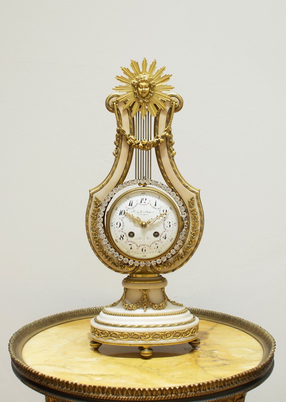 A French Marble And Ormolu Mount Lyre Mystery Mantel Clock.