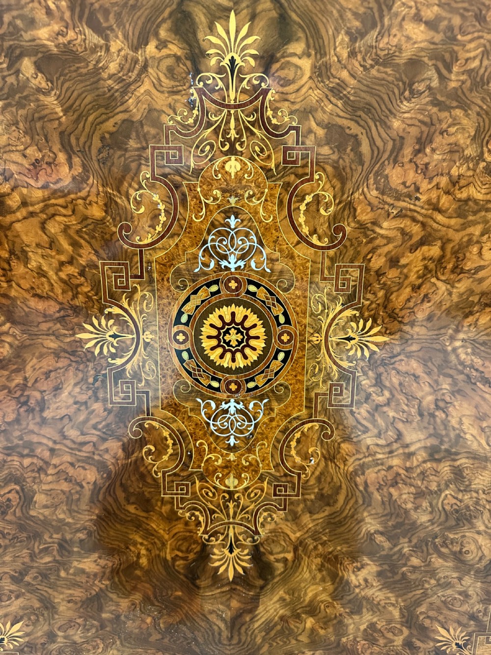 A Victorian burr walnut credenza sideboard featuring intricate marquetry inlay, a central panelled cupboard door, two curved glass display doors, and gilt brass mounts. View XV