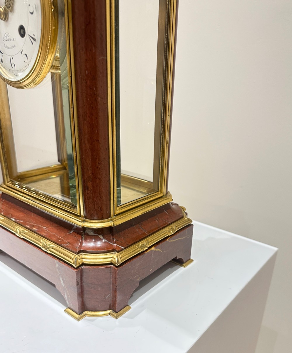 A French four-glass mantel clock featuring a rouge marble top and base, gilt ormolu mounts, a ribbon bow crest, and an enamel dial signed Le Roy & Fils. View V