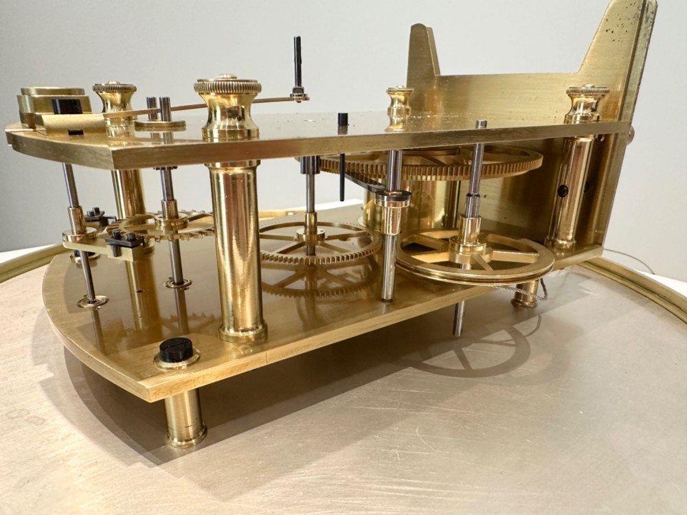An Edwardian Lenzkirch precision regulator longcase clock housed in a dark walnut case featuring a silvered dial and glazed door revealing a brass pendulum. View IV