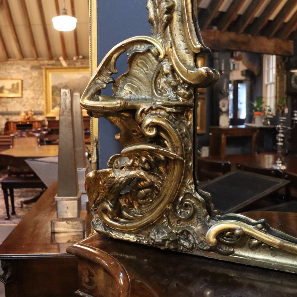 A large Rococo giltwood wall mirror featuring asymmetrical scrollwork, acanthus leaves, and carved ho-ho bird motifs. View II