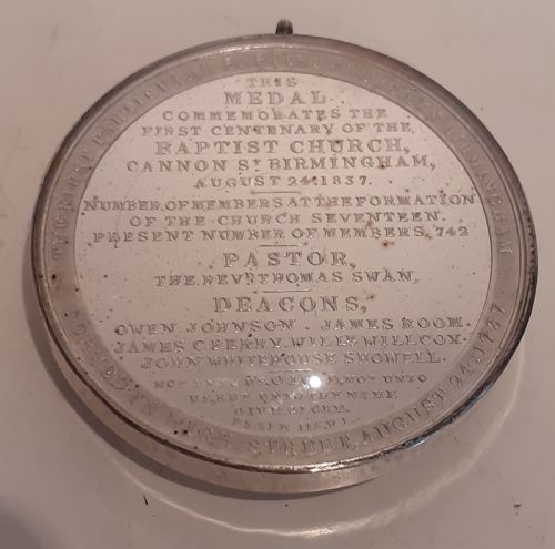 fig 2. A circular Victorian silver commemorative medal featuring an engraved architectural scene, housed in a velvet-lined Goldsmiths presentation case.