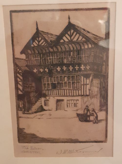 fig 1. A framed monochrome etching depicting the historic timber-framed Falcon building in Chester, presented within a light cream mount and slim black wooden frame.