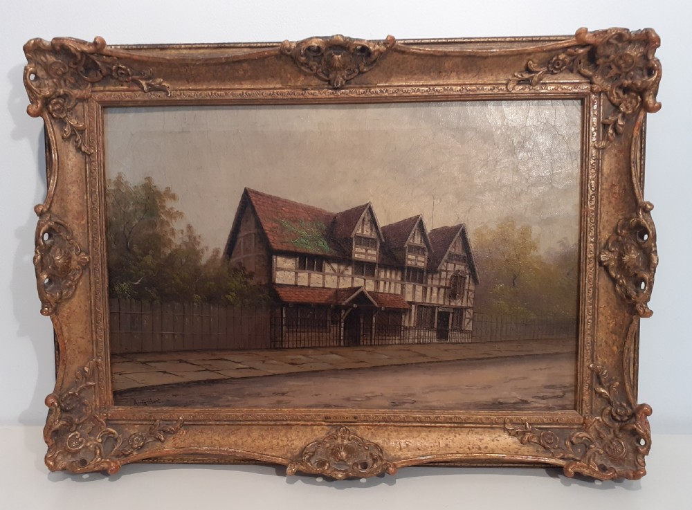 A nineteenth-century oil painting on canvas depicting Shakespeares timber-framed birthplace housed within an ornate gilded frame.