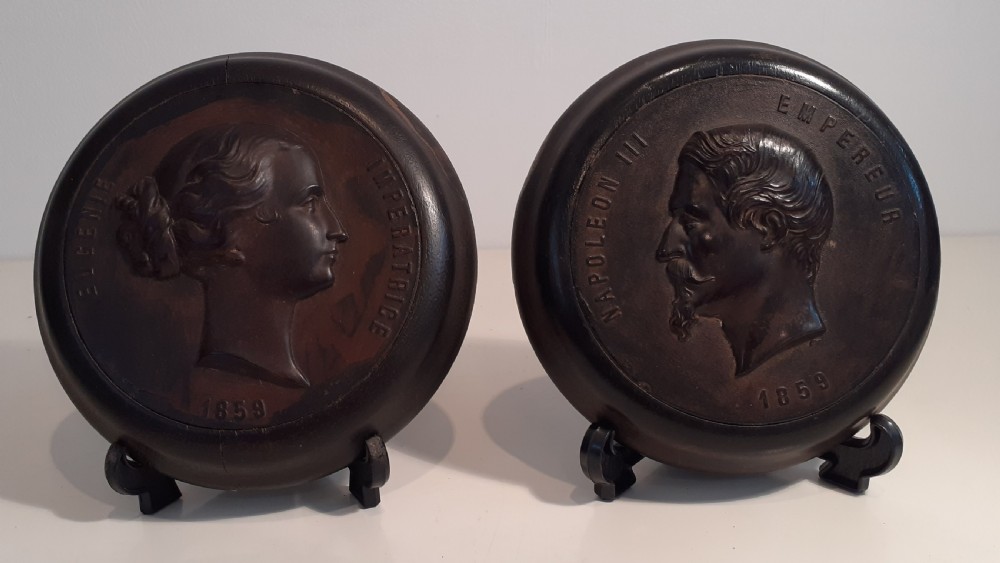 A pair of wall plaques depicting Napoleon III and his wife Eugenie, 1859