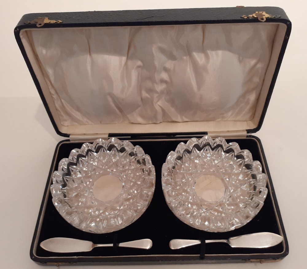 Pair of Crystal Butter dishes with two Silver Butter knives, Birmingham 1928