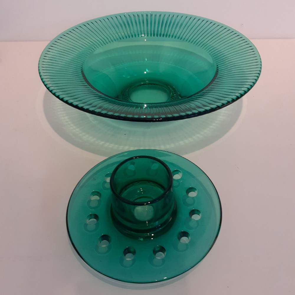 An Art Deco green pressed glass rose bowl featuring a wide fluted rim and a removable perforated central flower frog. View II
