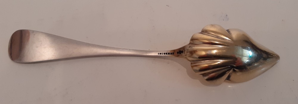 An antique sterling silver souvenir spoon featuring a gilt shell-shaped bowl and an embossed handle inscribed with Somerville and a historical building. View II
