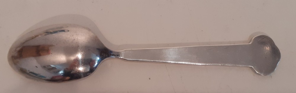 An antique silver souvenir spoon featuring an engraved bowl reading Bunker Hill alongside a handle depicting the Bunker Hill monument and the date 1775. View II
