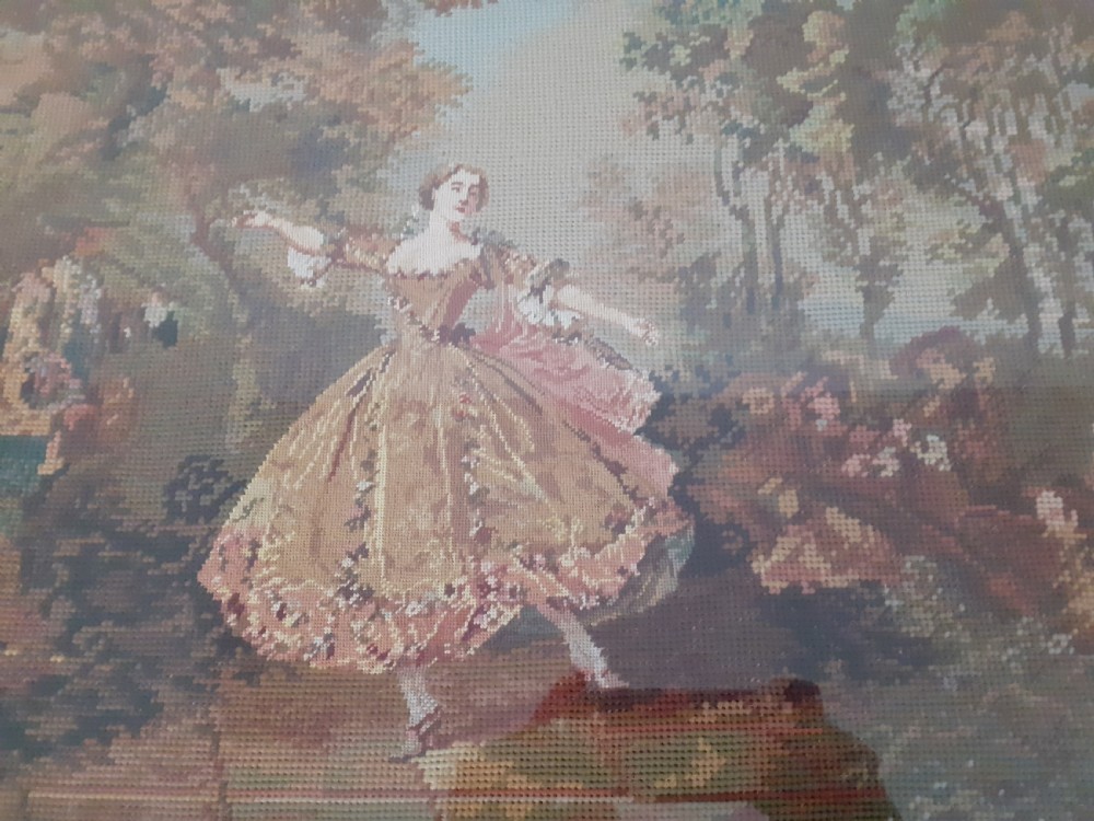 A nineteenth-century framed wool needlepoint artwork depicting a dancing figure in a landscape, presented in a polished rosewood frame. View II