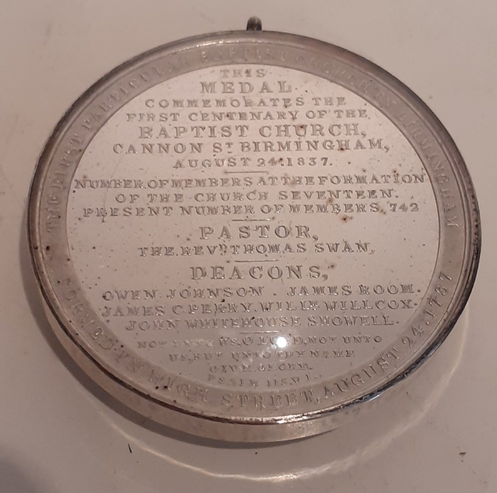 A circular Victorian silver commemorative medal featuring an engraved architectural scene, housed in a velvet-lined Goldsmiths presentation case. View III