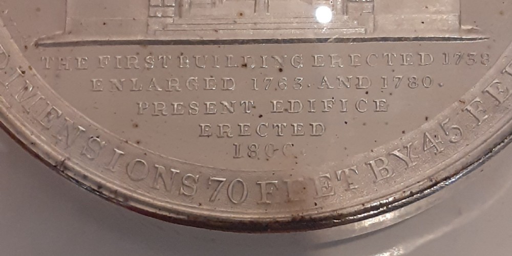 A circular Victorian silver commemorative medal featuring an engraved architectural scene, housed in a velvet-lined Goldsmiths presentation case. View IV