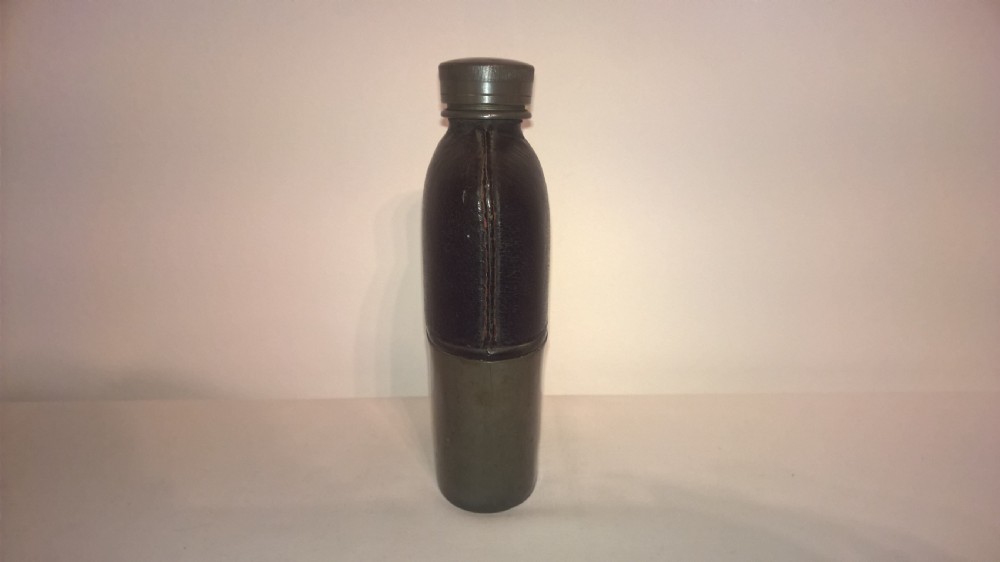 Late nineteenth century pocket hip flask featuring a black leather wrapped upper body and a pewter lower section with a screw top cap. View III