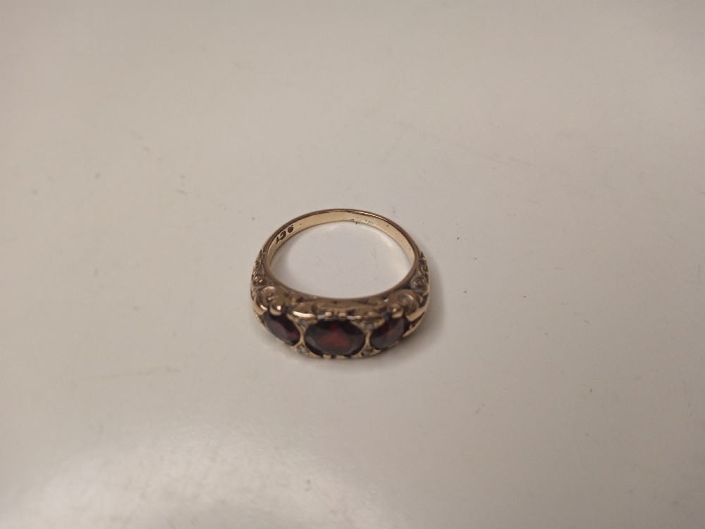 Nine Carat Gold Ring with Garnets and four small Diamonds View III