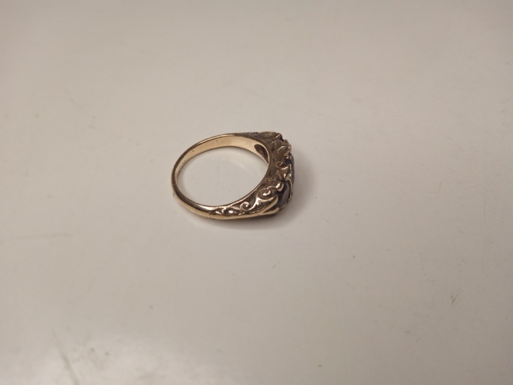 Nine Carat Gold Ring with Garnets and four small Diamonds View IV