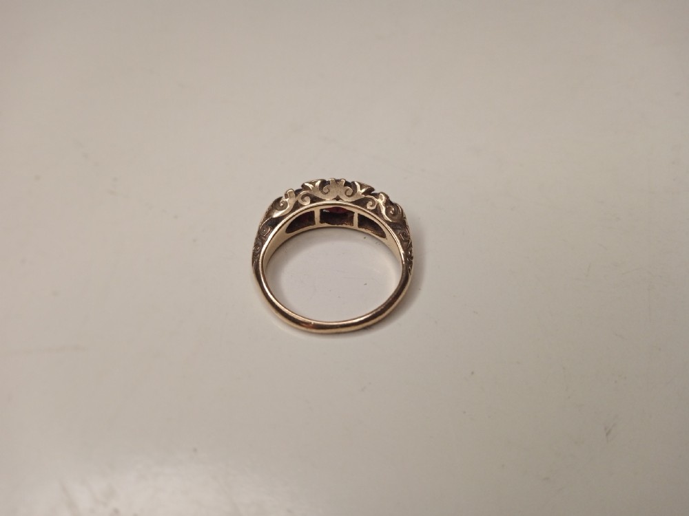 Nine Carat Gold Ring with Garnets and four small Diamonds View V