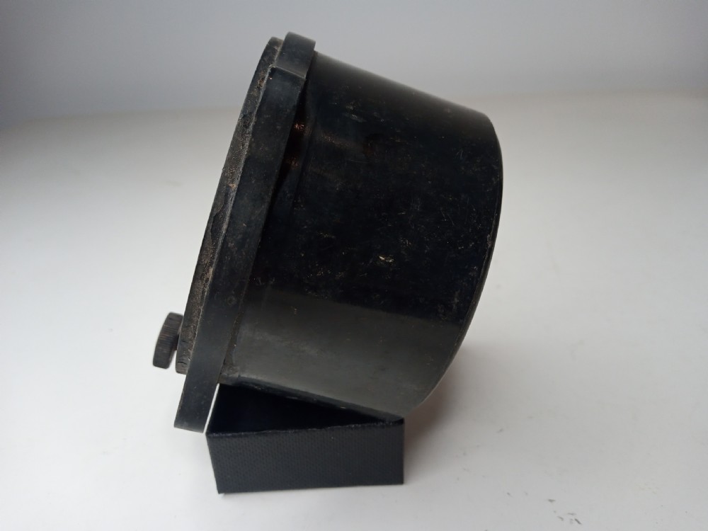 A square black metal Second World War German Luftwaffe aircraft altimeter gauge featuring white dial numbers from zero to five and a central adjustment knob. View III