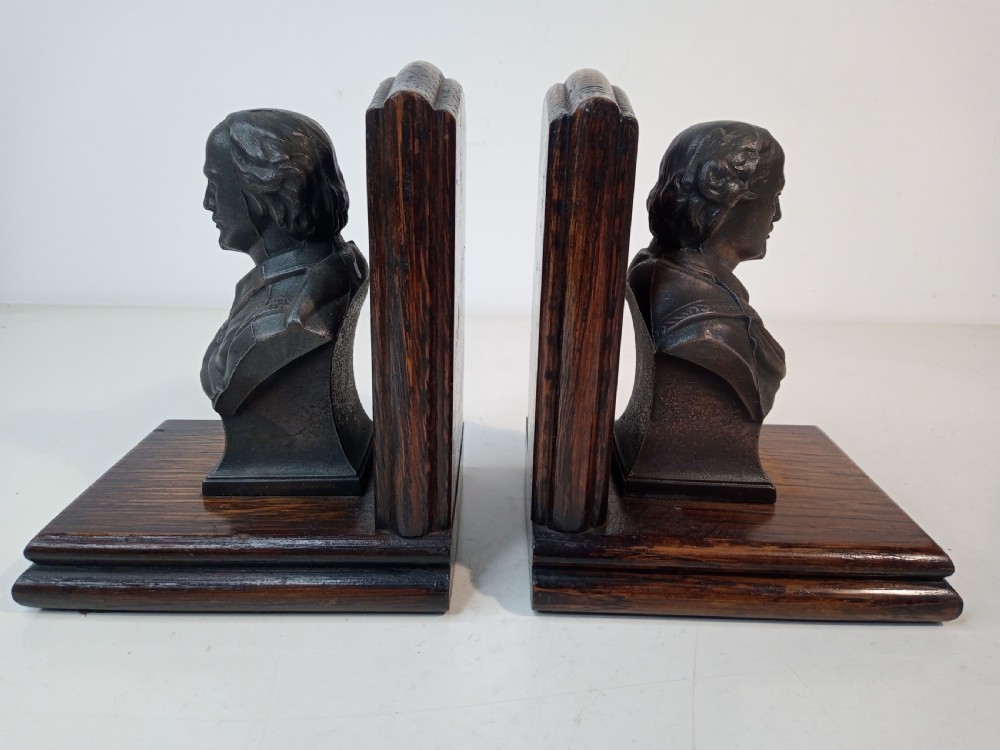 A pair of Art Deco bookends featuring metal busts of William Shakespeare mounted on dark oak bases. View II
