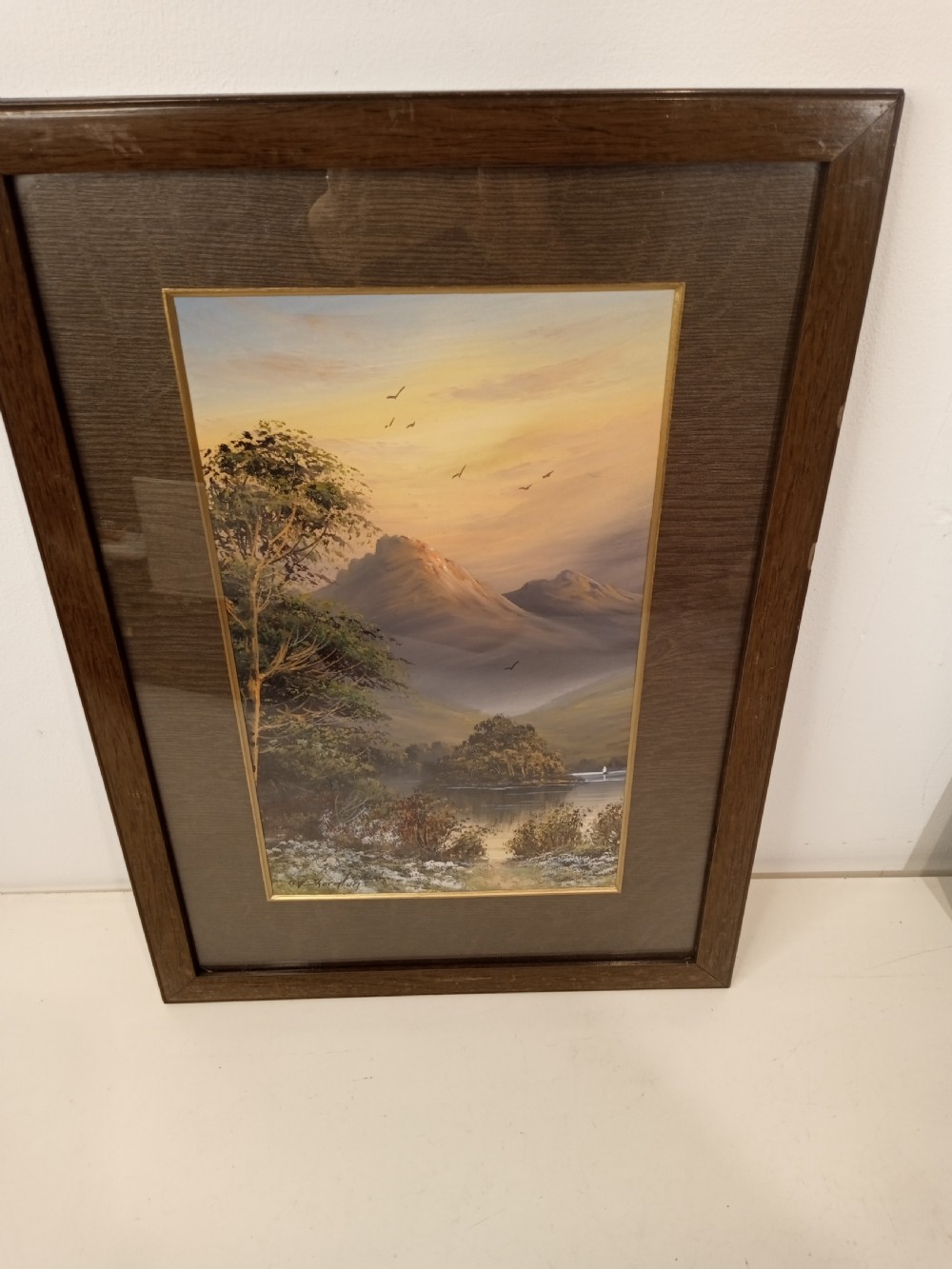 A pair of framed early 20th-century gouache landscape paintings depicting mountainous scenes with bodies of water framed in dark wooden mounts and frames. View IX