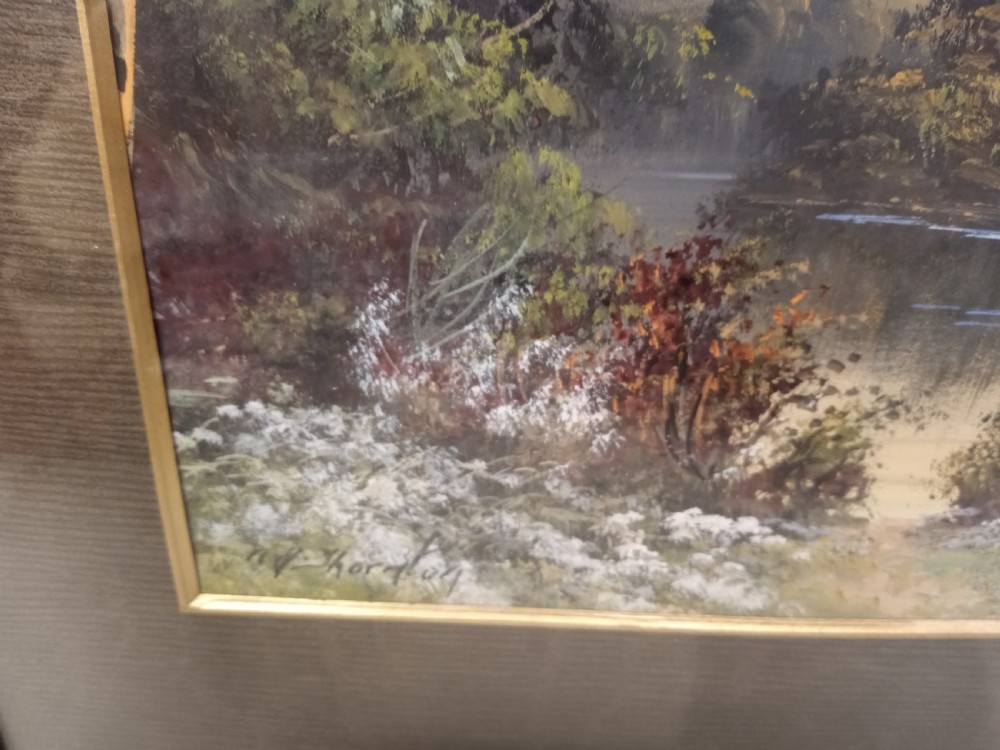 A pair of framed early 20th-century gouache landscape paintings depicting mountainous scenes with bodies of water framed in dark wooden mounts and frames. View X