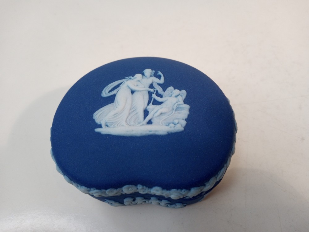 A pair of kidney-shaped blue Wedgwood jasperware trinket boxes with white classical bas-relief scenes on their lids. View III