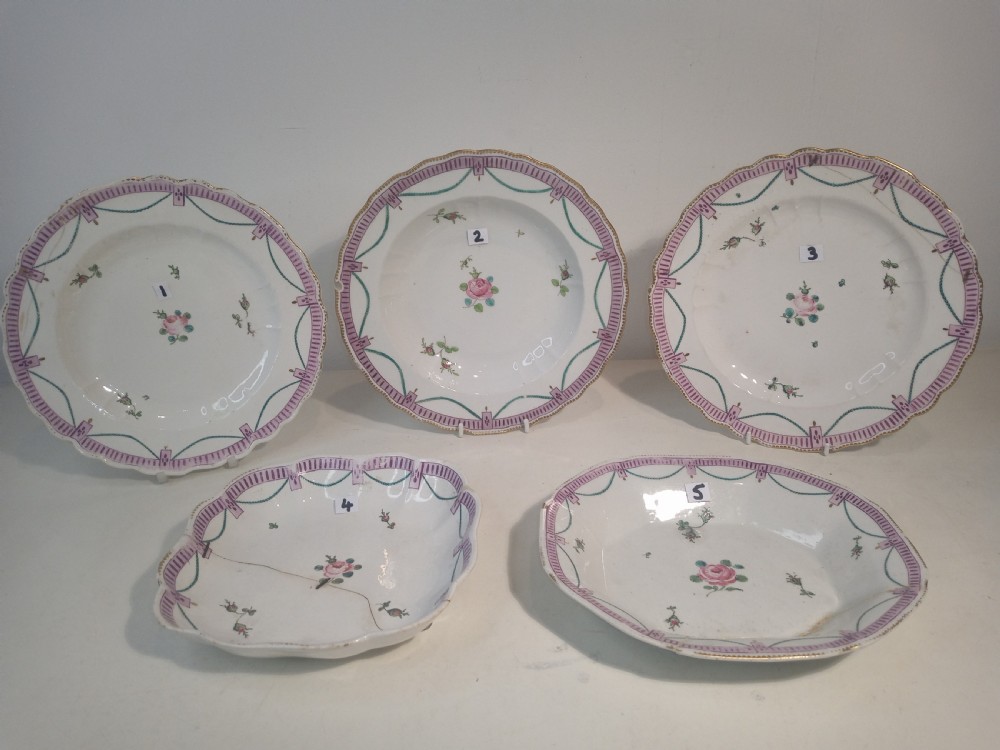 A set of five mid-18th-century Georgian Chelsea soft-paste porcelain plates and shallow bowls decorated with painted floral sprays and pink diaper borders. View II