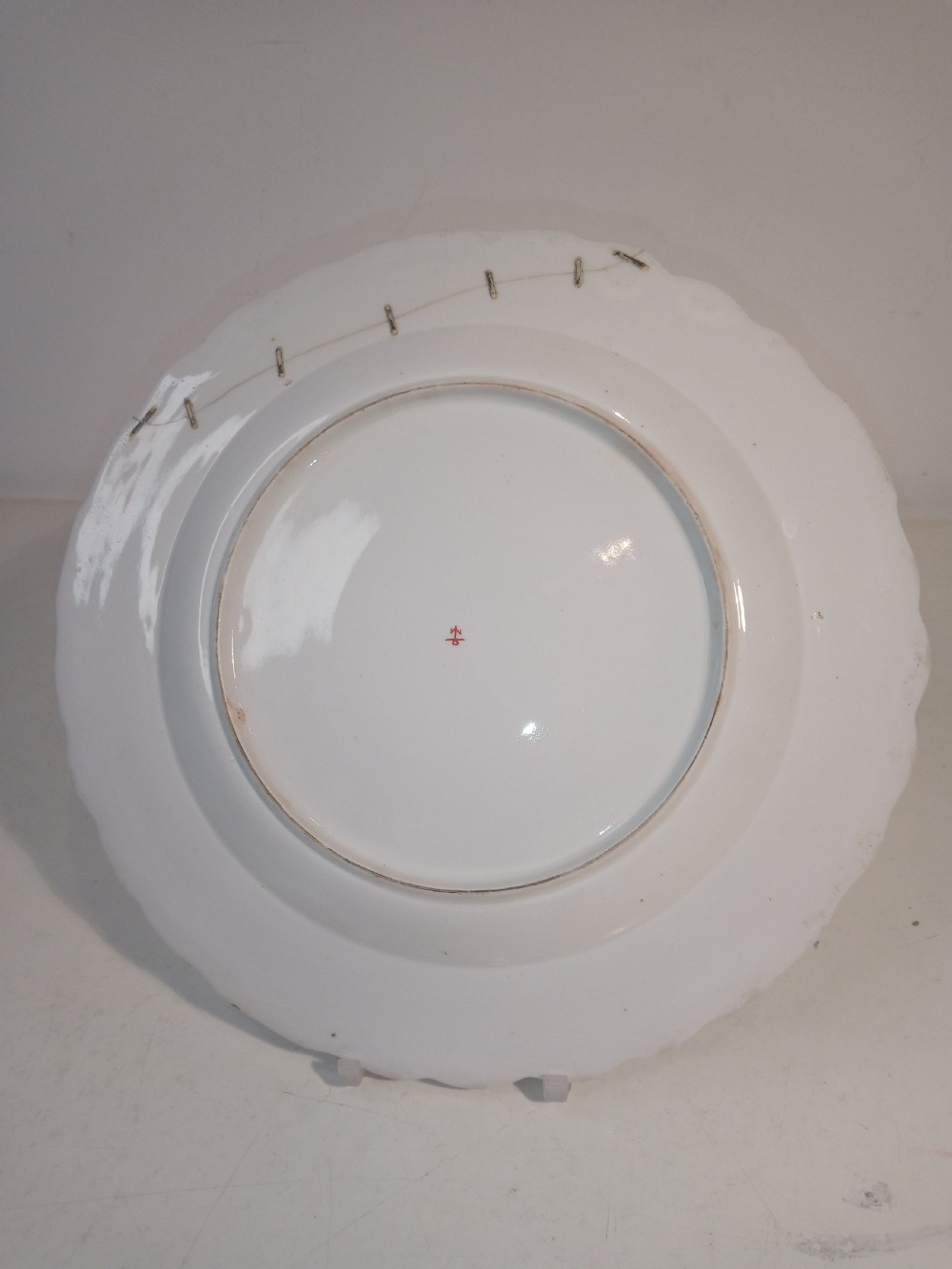 A set of five mid-18th-century Georgian Chelsea soft-paste porcelain plates and shallow bowls decorated with painted floral sprays and pink diaper borders. View XIII