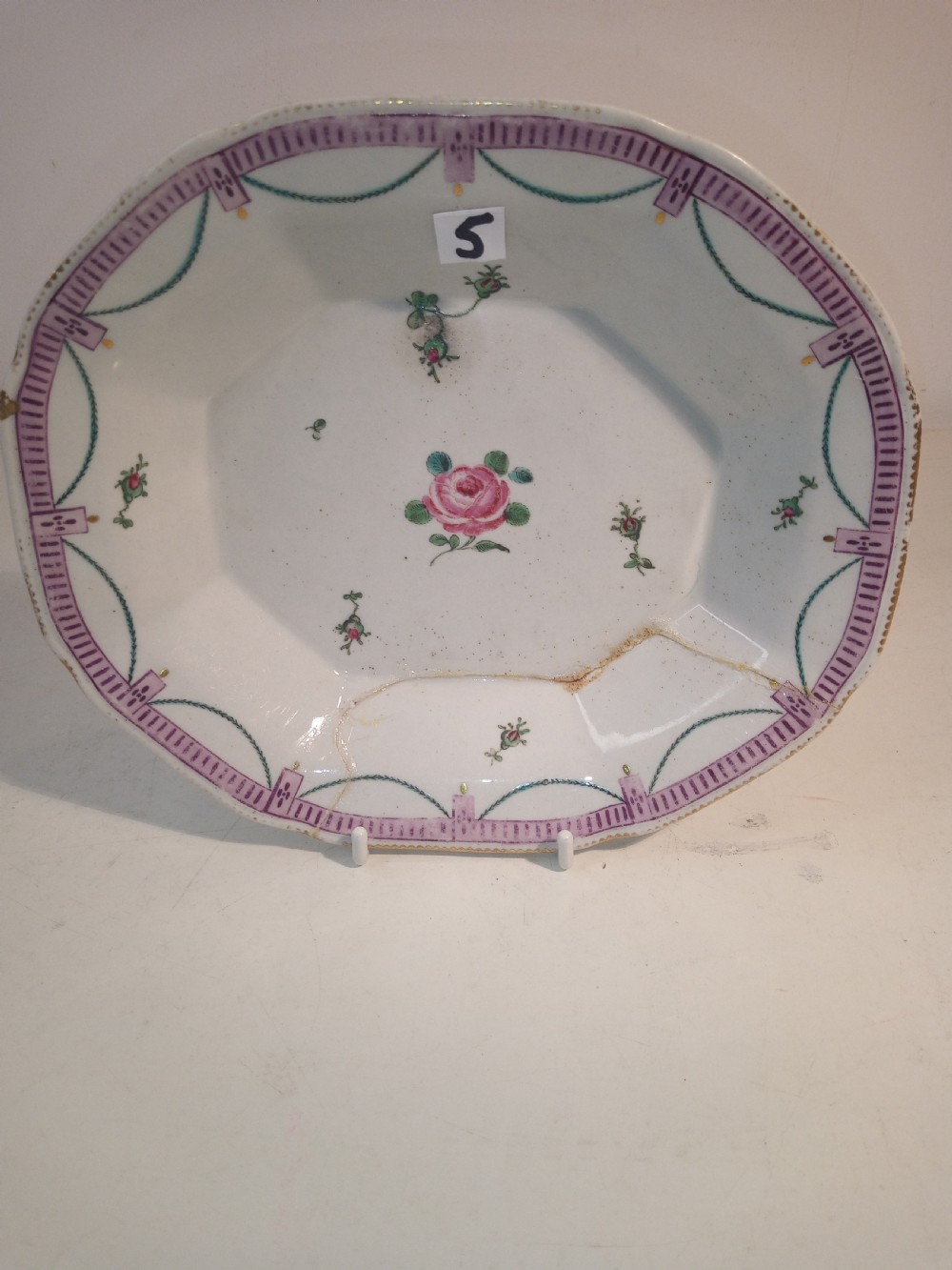 A set of five mid-18th-century Georgian Chelsea soft-paste porcelain plates and shallow bowls decorated with painted floral sprays and pink diaper borders. View XVII