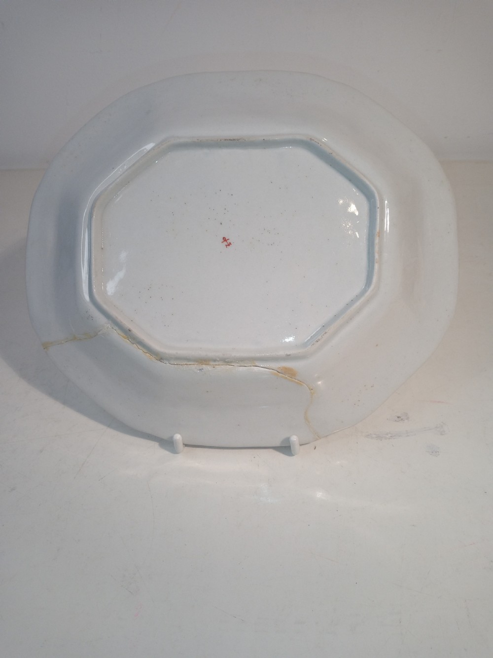 A set of five mid-18th-century Georgian Chelsea soft-paste porcelain plates and shallow bowls decorated with painted floral sprays and pink diaper borders. View XIX