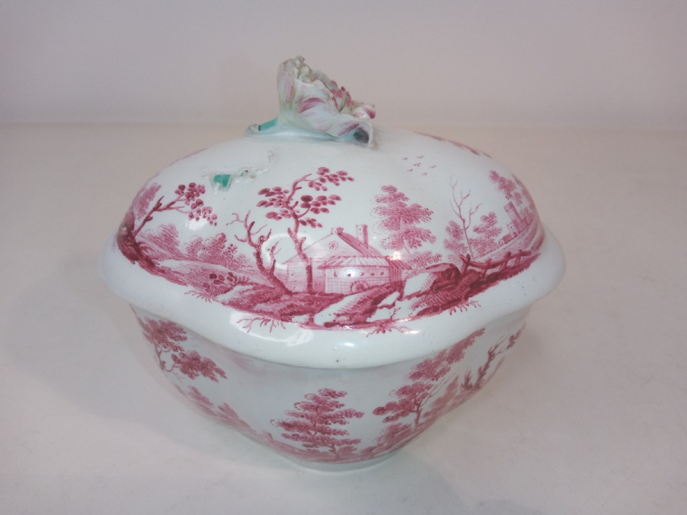 An 18th-century white porcelain lidded sugar bowl decorated with red hand-painted landscape scenes and topped with a sculpted floral finial. View II