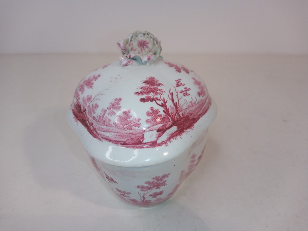 An 18th-century white porcelain lidded sugar bowl decorated with red hand-painted landscape scenes and topped with a sculpted floral finial. View III