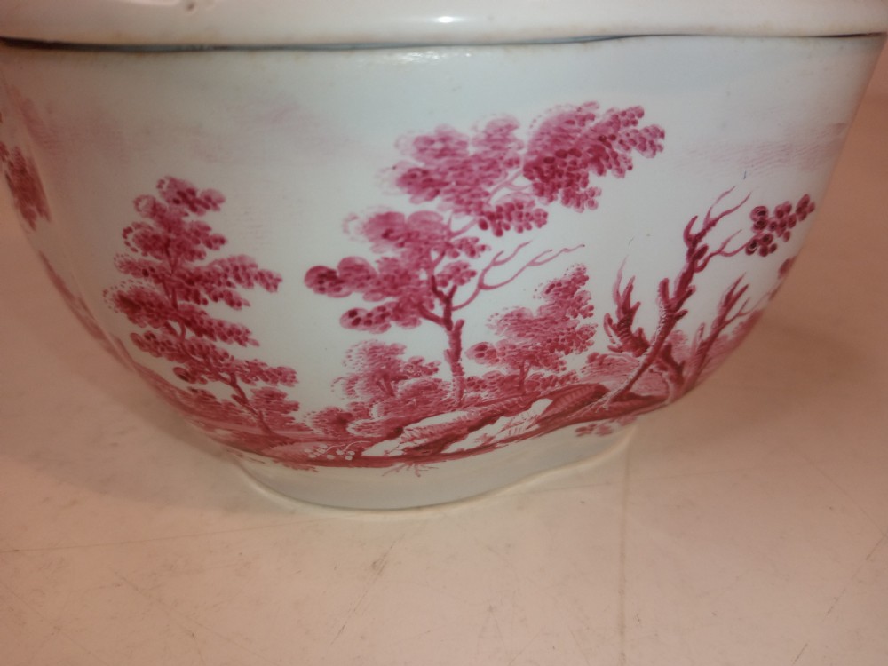An 18th-century white porcelain lidded sugar bowl decorated with red hand-painted landscape scenes and topped with a sculpted floral finial. View VIII