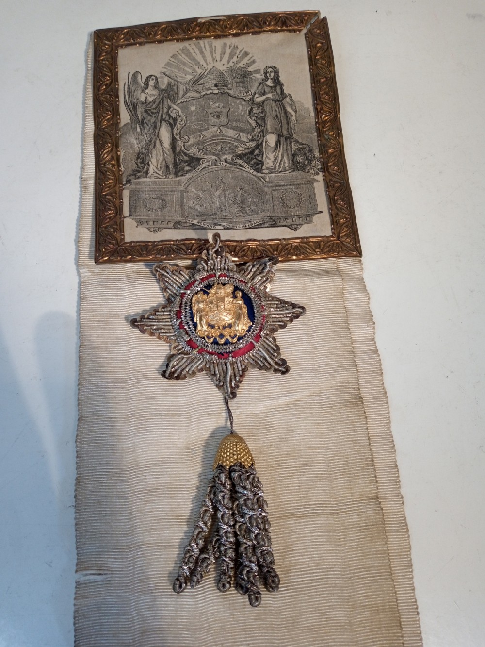 A late 19th-century off-white woven silk temperance movement ceremonial sash with silver bullion fringe, tassels, and an attached framed certificate. View II