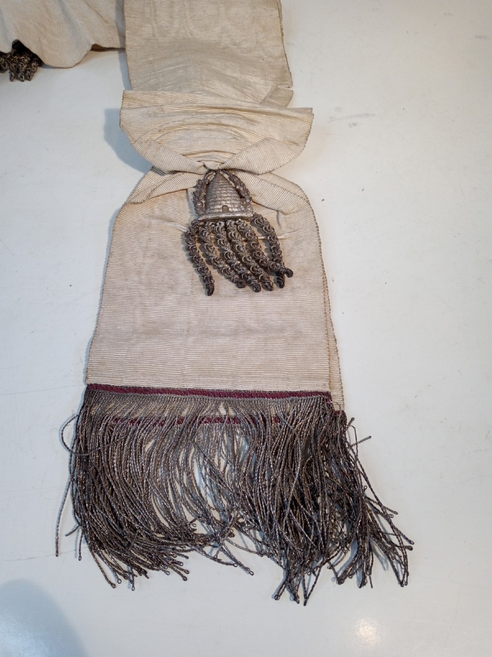 A late 19th-century off-white woven silk temperance movement ceremonial sash with silver bullion fringe, tassels, and an attached framed certificate. View V