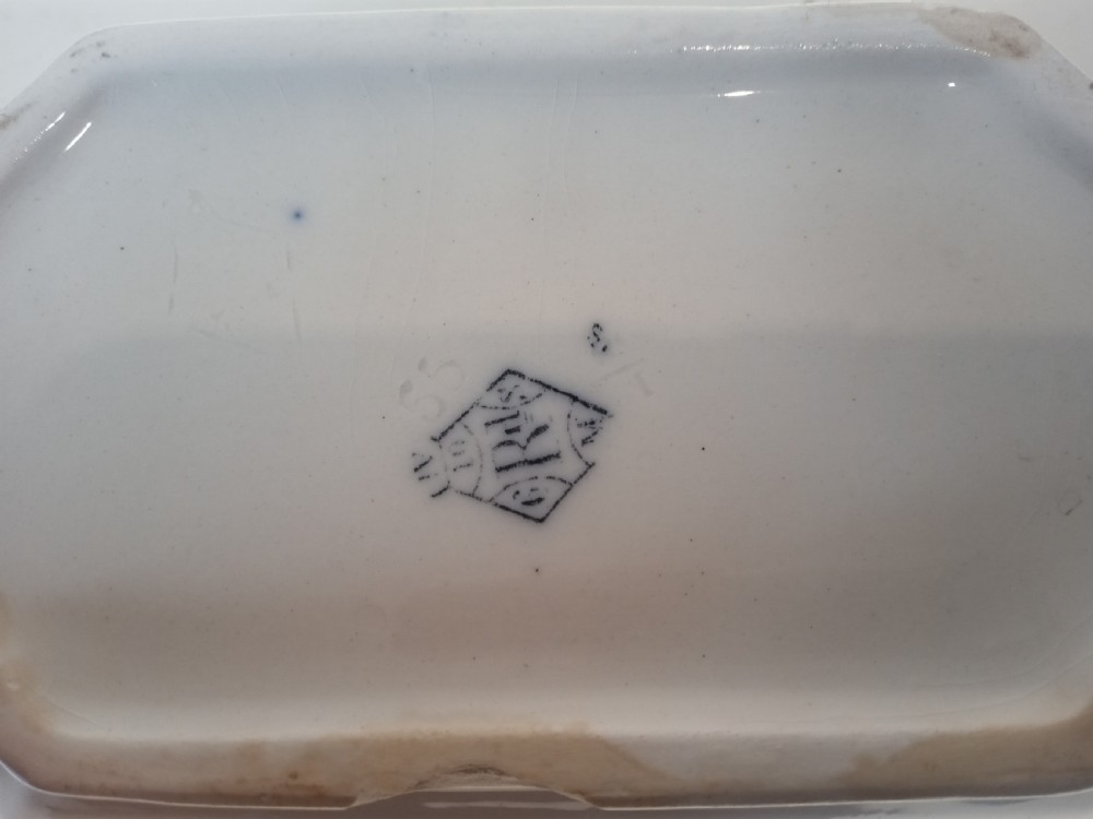 A Victorian Staffordshire earthenware tureen and matching stand with blue and white transferware illustrations of waterfowl and rabbits. View VIII