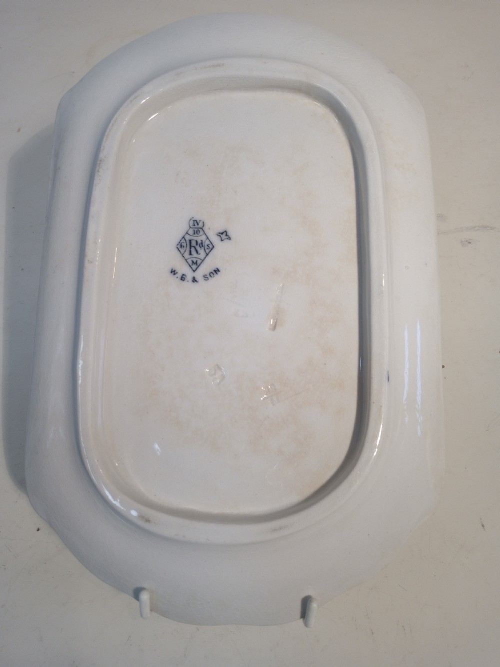 A Victorian Staffordshire earthenware tureen and matching stand with blue and white transferware illustrations of waterfowl and rabbits. View X