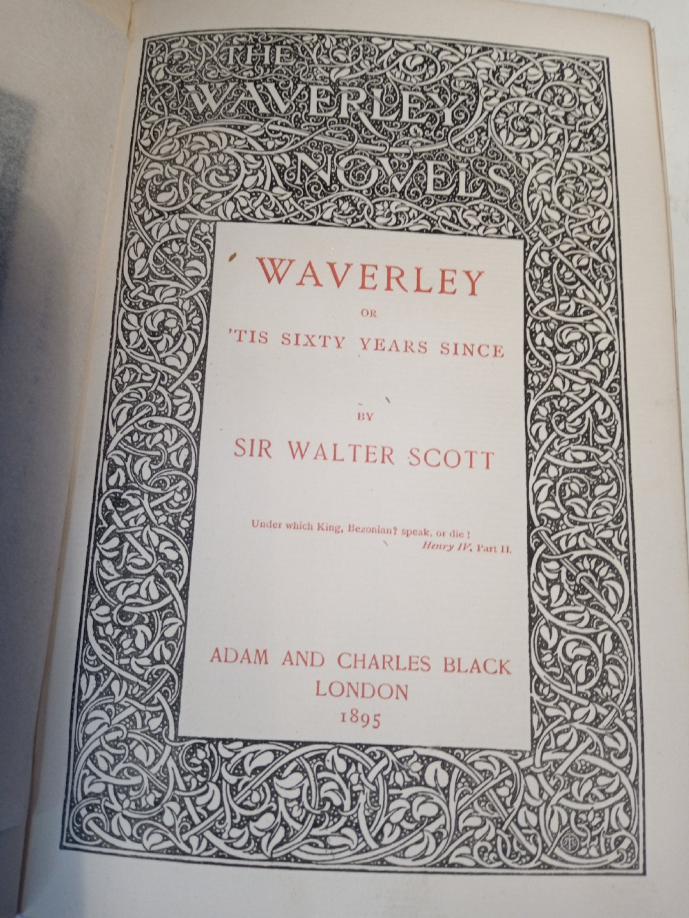 A complete set of 25 Victorian leather-bound Waverley Novels arranged side by side with gilt tooling and red title blocks along the spines. View X