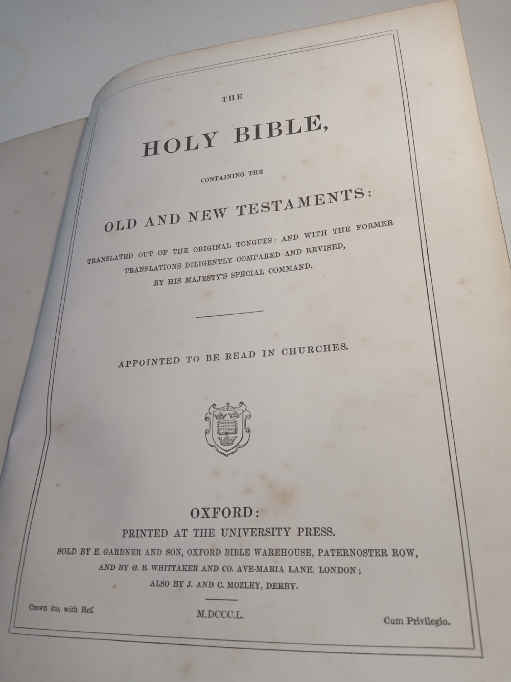 A mid-nineteenth-century Holy Bible featuring a brown leather spine with raised bands and ornate brass mounts over wooden covers. View XII