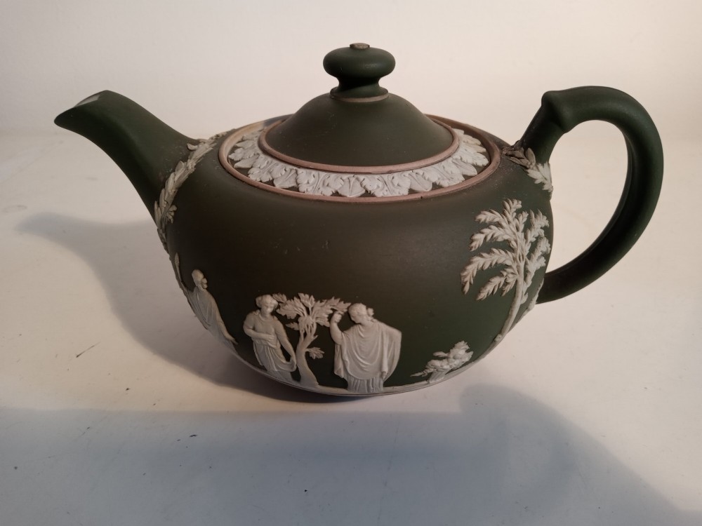 A late nineteenth-century three-piece olive green Wedgwood jasperware bachelor tea set adorned with white Neoclassical relief figures and foliage. View III